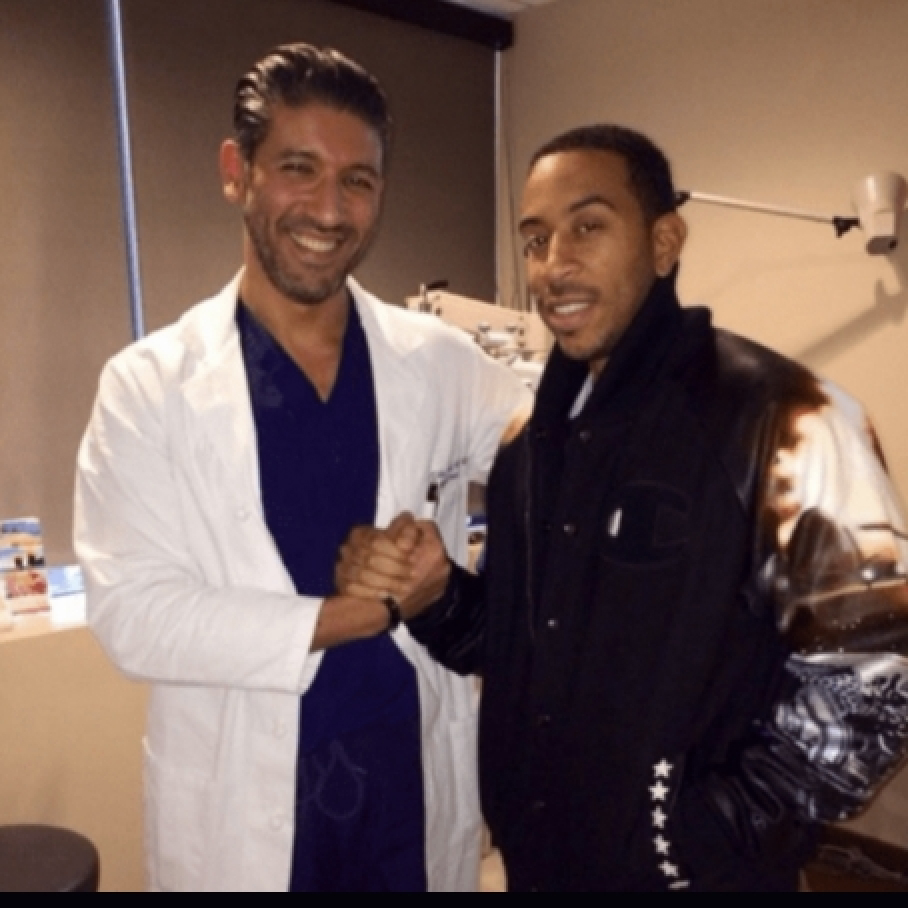 Dr. Soroudi with Ludacris smiling